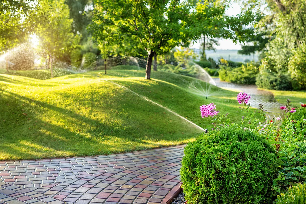 Garden irrigation system watering established beds in Perth